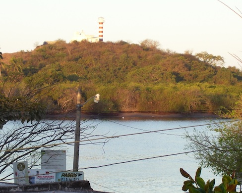 patch of estuary with lighthouse on the opposite bank