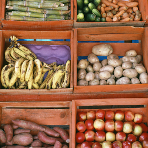 vegetables in wooden bins at Mexican market