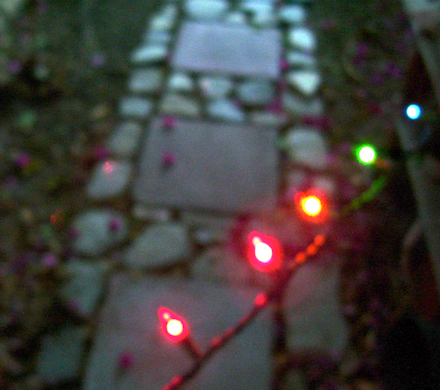 Five colored lights against the stepping stones