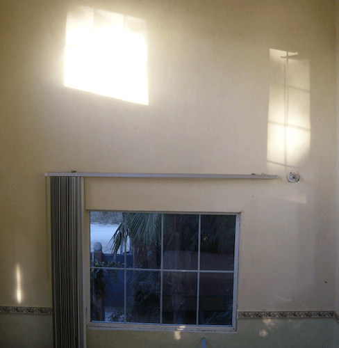 window and light on the tall walls