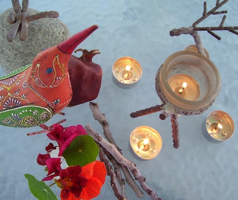 five tealight candles, flowers, orange metal bird