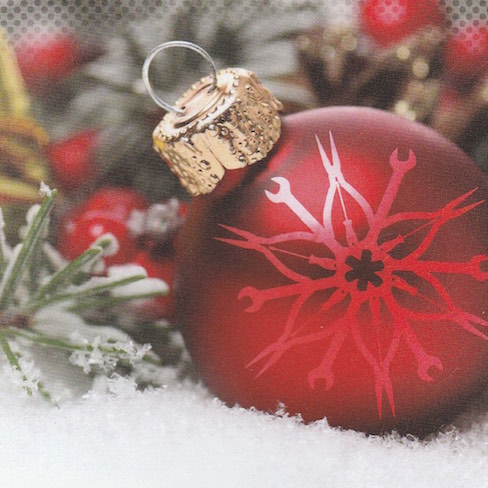 red Christmas ornament in snow